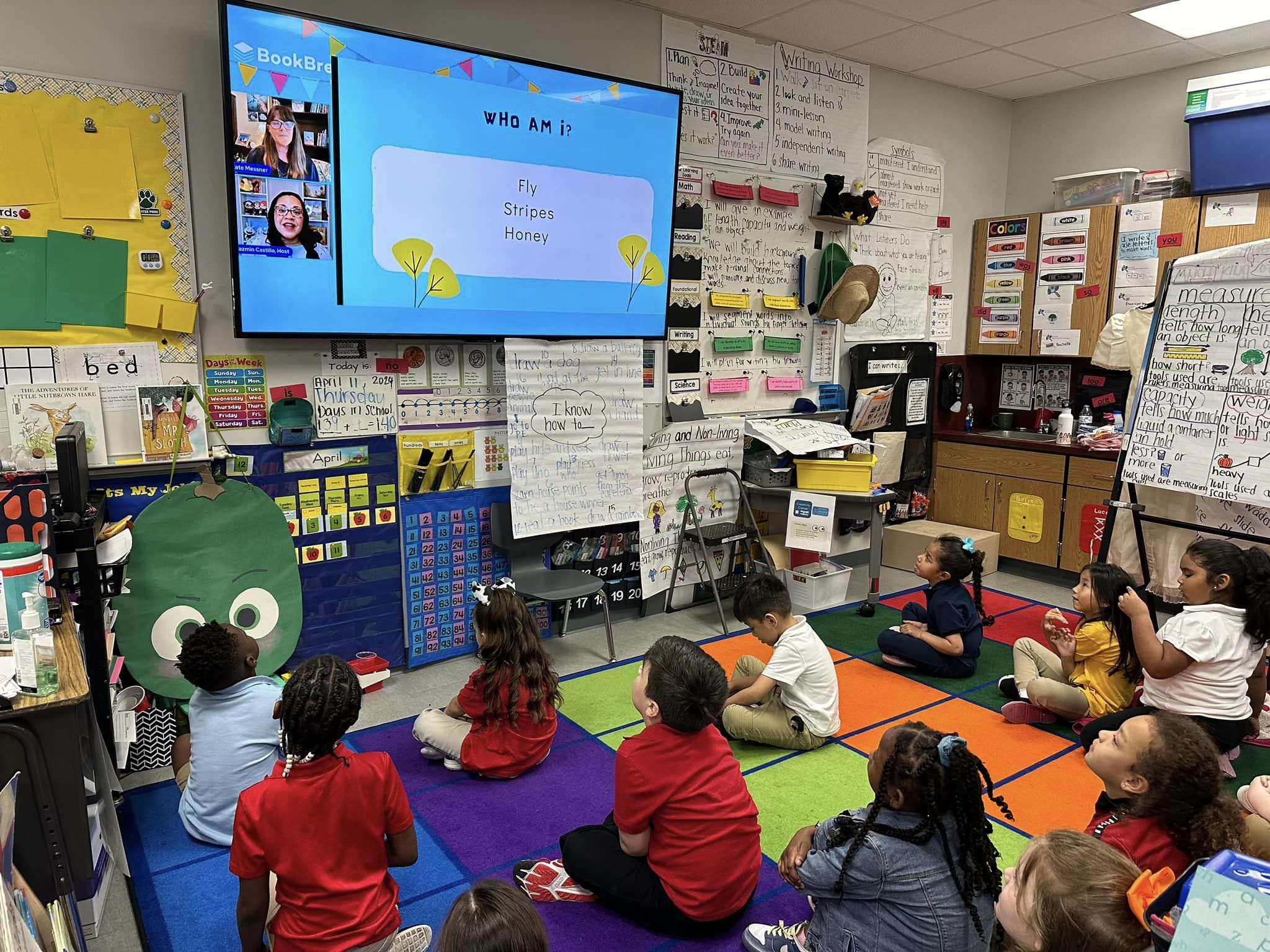 An image of students viewing a virtual author talk enriching, and motivating student learning about the cycle of a garden.